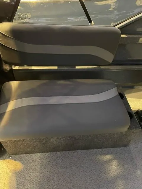 Slide: The Image of 2024 Spartan 185 Astoria boat interior seating with gray upholstery. - 8
