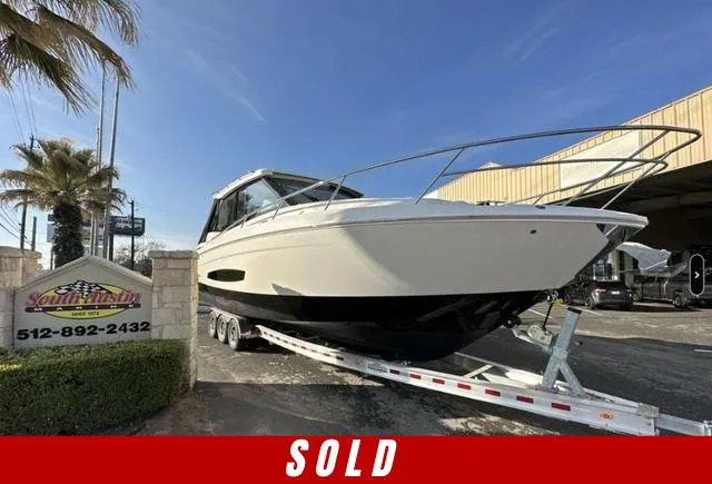 Slide: The Image of 2023 Regal 36 Grande Coupe boat on trailer, marked "SOLD." - 0