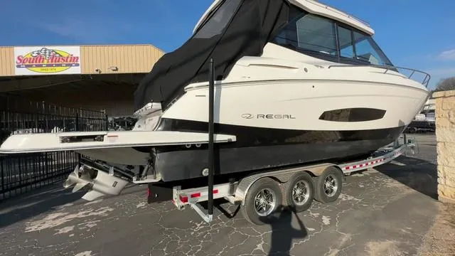 Slide: The Image of 2023 Regal 36 Grande Coupe boat on trailer at South Austin dealership. - 2