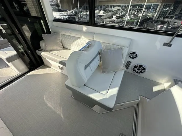 Slide: The Image of 2023 Regal 36 Grande Coupe interior with plush seating and modern design. - 20