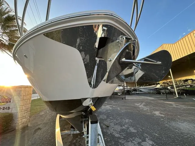 Slide: The Image of 2023 Regal 36 Grande Coupe boat on trailer, close-up of propeller and hull. - 32