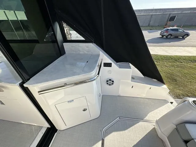 Slide: The Image of 2023 Regal 36 Grande Coupe yacht interior with sleek countertop and modern design. - 34