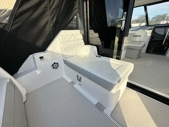 Slide: The Image of 2023 Regal 36 Grande Coupe interior with white seating and modern design. - 37