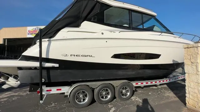 Slide: The Image of 2023 Regal 36 Grande Coupe boat on a trailer, side view. - 4