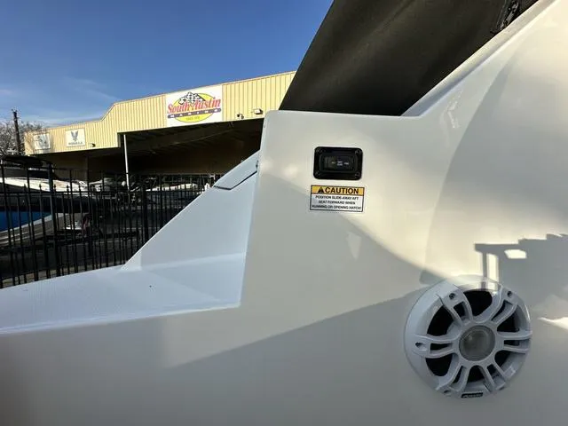 Slide: The Image of 2023 Regal 36 Grande Coupe boat detail with speaker and caution sign. - 44