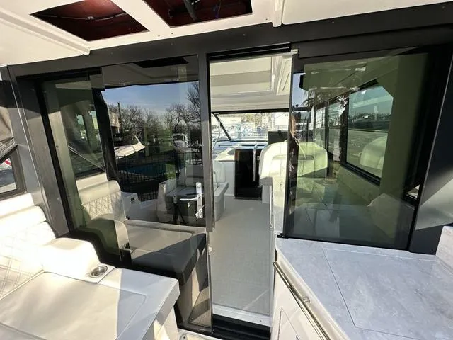 Slide: The Image of Interior view of 2023 Regal 36 Grande Coupe yacht, featuring modern design and spacious layout. - 47