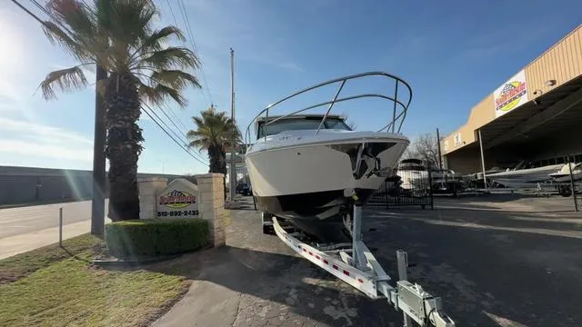 Slide: The Image of 2023 Regal 36 Grande Coupe boat on trailer outside dealership. - 5