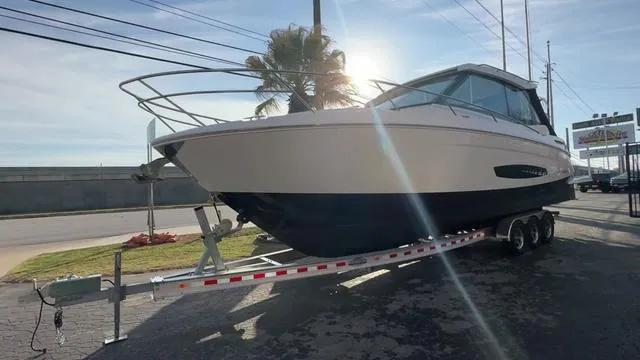Slide: The Image of 2023 Regal 36 Grande Coupe boat on trailer, parked outdoors. - 8