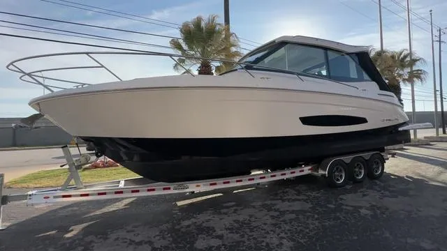 Slide: The Image of 2023 Regal 36 Grande Coupe boat on trailer, side view, sunny day. - 9
