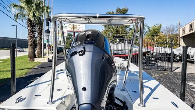 Slide: The Image of 2024 Hewes 16 Redfisher boat with outboard motor, rear view. - 10