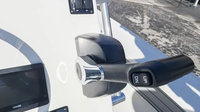 Slide: The Image of Close-up of 2024 Hewes 16 Redfisher boat throttle control. - 20