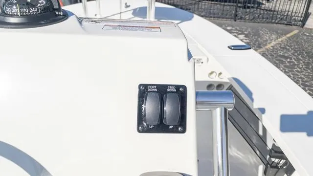 Slide: The Image of Control panel of 2024 Hewes 16 Redfisher boat with port and starboard switches. - 21