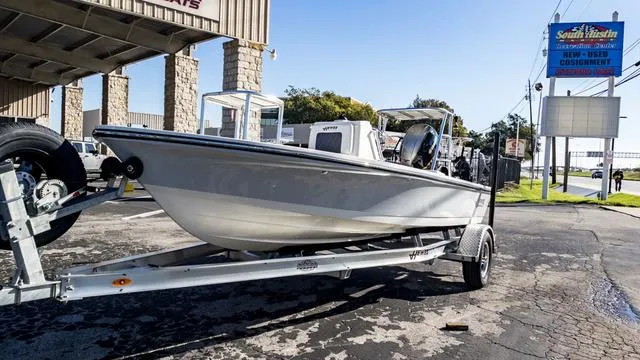 Slide: The Image of 2024 Hewes 16 Redfisher boat on a trailer at a dealership. - 4