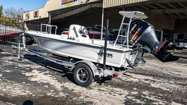 Slide: The Image of 2024 Hewes 16 Redfisher boat on trailer with Yamaha outboard motor. - 6