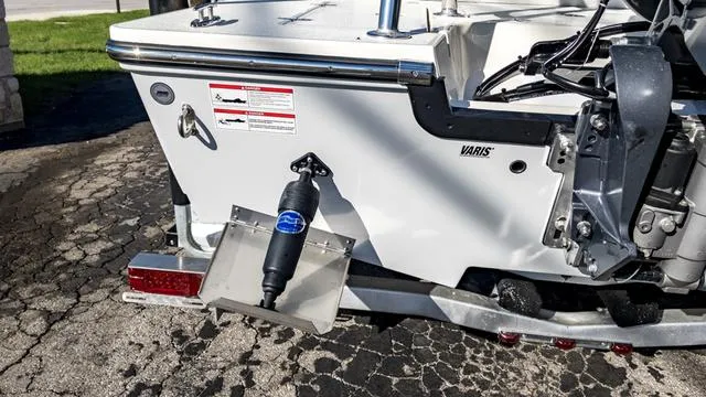 Slide: The Image of 2024 Hewes 16 Redfisher boat stern with motor and trim tab. - 9