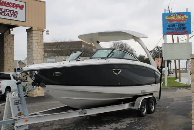Slide: The Image of 2024 Regal LS6 Surf boat on trailer at dealership. - 13