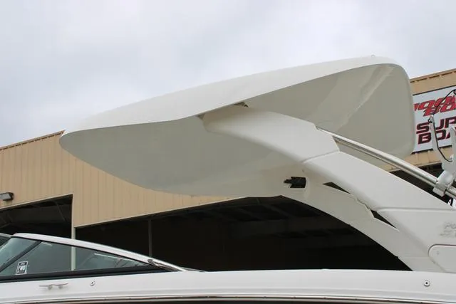 Slide: The Image of 2024 Regal LS6 Surf boat with sleek white design and modern features. - 19