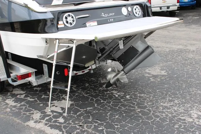 Slide: The Image of 2024 Regal LS6 Surf boat stern with ladder and propeller. - 20
