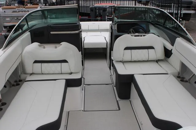 Slide: The Image of 2024 Regal LS6 Surf boat interior with luxurious white seating and modern design. - 21