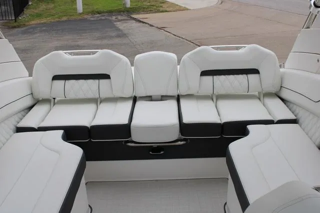 Slide: The Image of 2024 Regal LS6 Surf boat interior with luxurious white seating. - 22