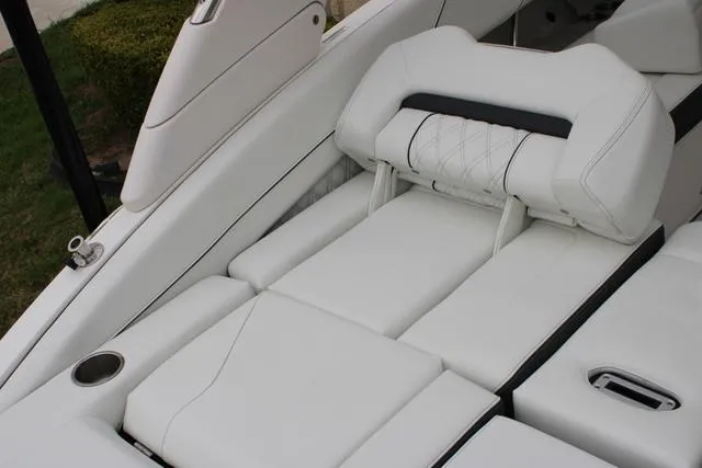 Slide: The Image of 2024 Regal LS6 Surf boat interior with luxurious white seating. - 25