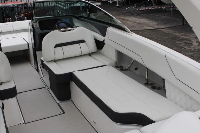 Slide: The Image of 2024 Regal LS6 Surf boat interior with white leather seating and modern design. - 41