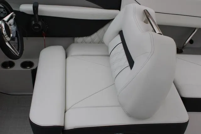 Slide: The Image of 2024 Regal LS6 Surf boat interior with luxurious white seating and modern design. - 43