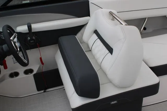Slide: The Image of 2024 Regal LS6 Surf boat interior with white and black seating. - 44