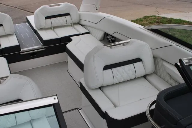 Slide: The Image of 2024 Regal LS6 Surf boat interior with luxurious white seating and modern design. - 48