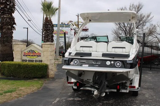 Slide: The Image of 2024 Regal LS6 Surf boat parked at South Austin Marine dealership. - 7
