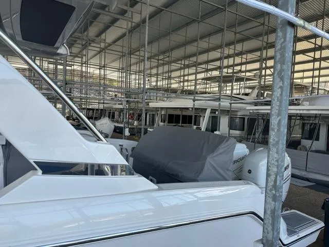Slide: The Image of 2021 Tiara Yachts 34 LS in a covered marina storage facility. - 3
