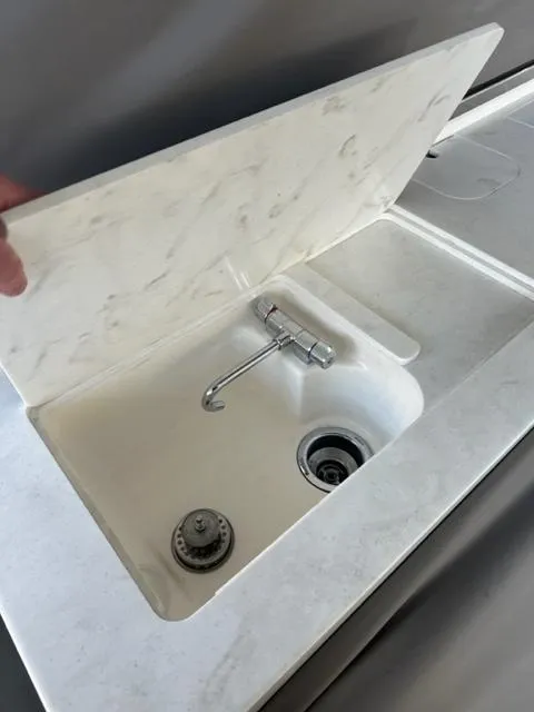 Slide: The Image of 2021 Tiara Yachts 34 LS sink with marble cover and modern faucet. - 4