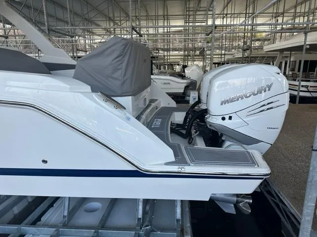 Slide: The Image of 2021 Tiara Yachts 34 LS with Mercury outboard engine in a marina. - 6