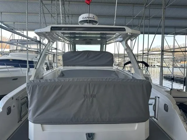 Slide: The Image of 2021 Tiara Yachts 34 LS boat docked, covered seating area, Garmin radar. - 7