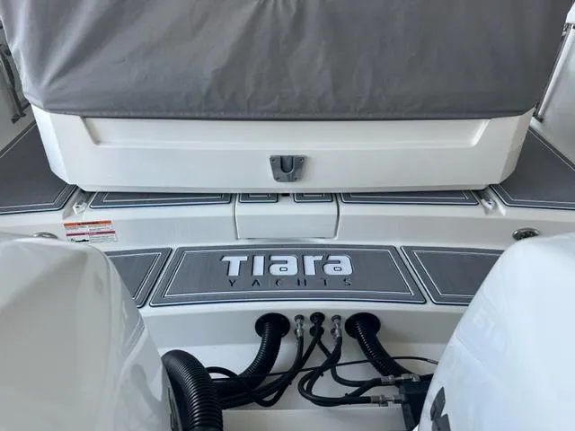 Slide: The Image of 2021 Tiara Yachts 34 LS stern view with logo and engine connections. - 8