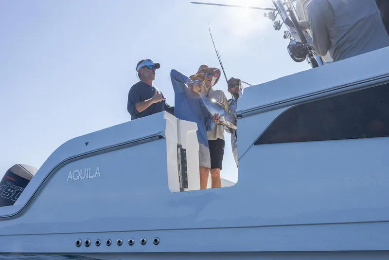 Slide: The Image of People fishing on a 2024 Aquila 47 Molokai boat. - 23