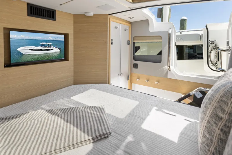 Slide: The Image of Interior cabin of 2024 Aquila 47 Molokai with bed, TV, and window view. - 30