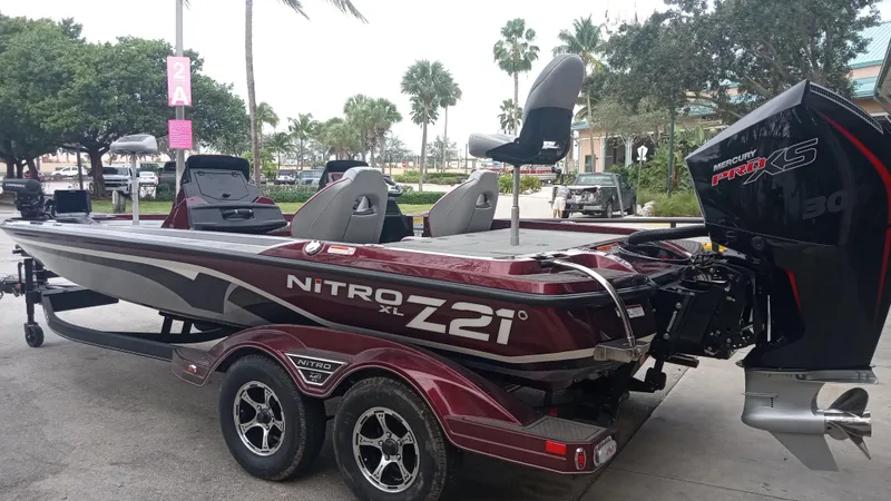 Slide: The Image of 2024 Nitro Z21 XL Pro bass boat with Mercury Pro XS engine. - 2