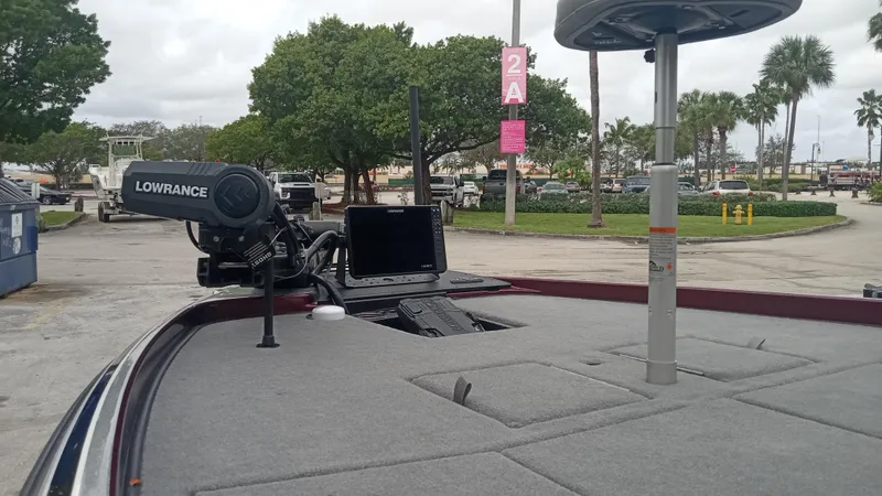 Slide: The Image of 2024 Nitro Z21 XL Pro boat with Lowrance electronics at a marina. - 3