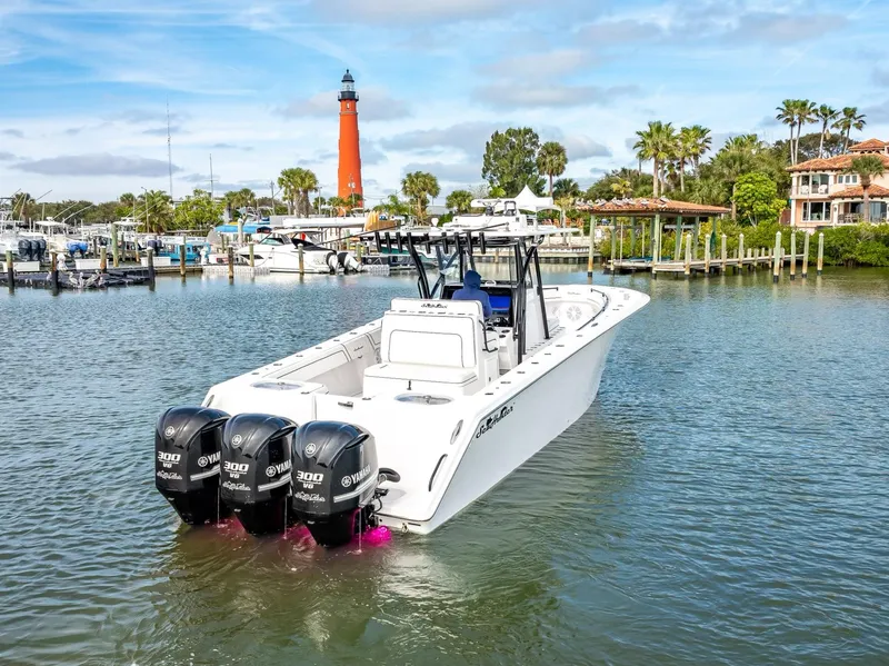 Slide: The Image of 2020 SeaHunter 35 Tournament boat with triple engines in a marina. - 18