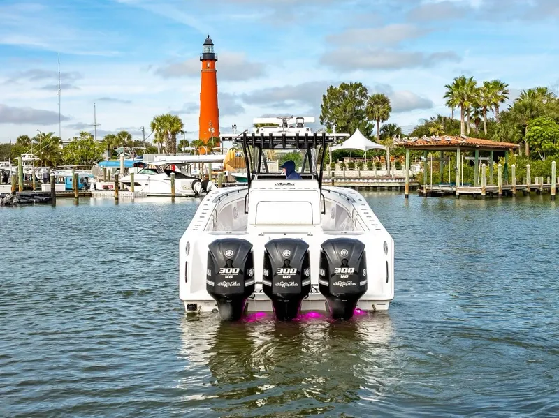 Slide: The Image of SeaHunter 35 Tournament 2020 boat with triple engines near a lighthouse. - 20