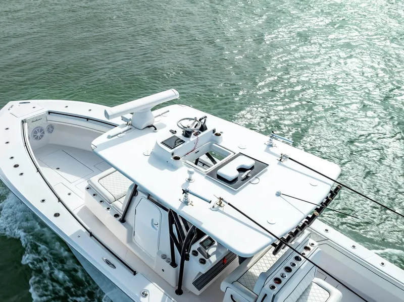 Slide: The Image of 2020 SeaHunter 35 Tournament boat cruising on water. - 23