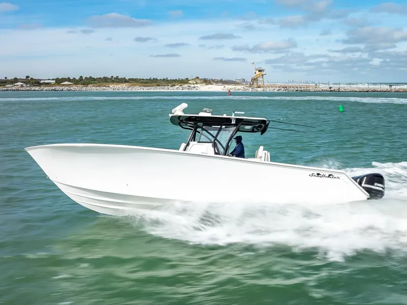 Slide: The Image of 2020 SeaHunter 35 Tournament boat speeding on water. - 3