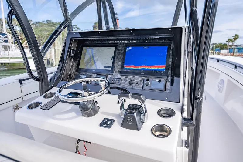 Slide: The Image of 2020 SeaHunter 35 Tournament boat console with dual displays and steering wheel. - 30