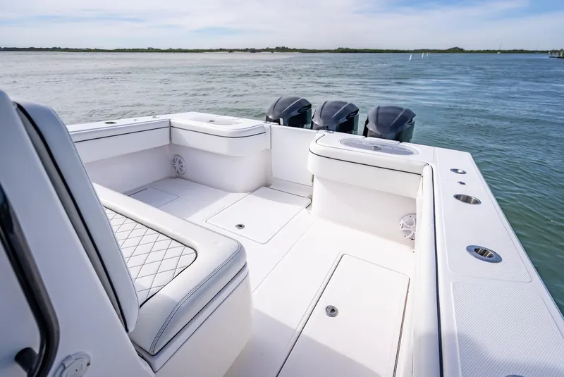 Slide: The Image of 2020 SeaHunter 35 Tournament boat with spacious deck and triple outboard engines. - 45
