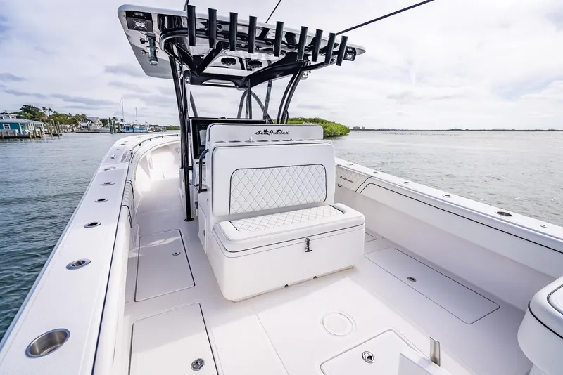 Slide: The Image of 2020 SeaHunter 35 Tournament boat interior with seating and rod holders. - 46