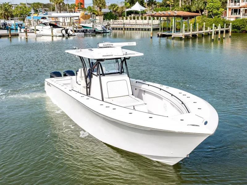 Slide: The Image of 2020 SeaHunter 35 Tournament boat cruising in a marina. - 8