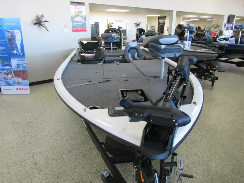 Slide: The Image of 2024 Vexus AVX 1980C fishing boat displayed in showroom. - 2