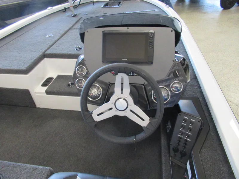 Slide: The Image of 2024 Vexus AVX 1980C boat dashboard with steering wheel and electronic display. - 5
