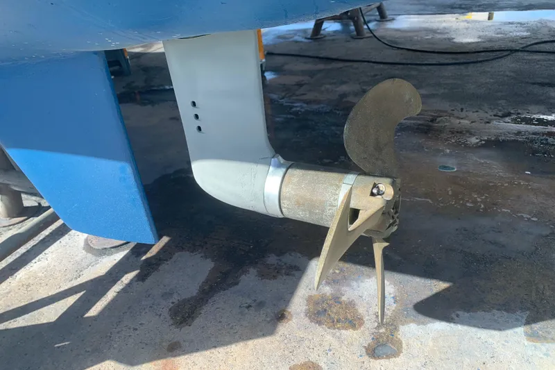 Slide: The Image of Propeller and rudder of a 2002 Dolphin 43 boat on dry dock. - 18